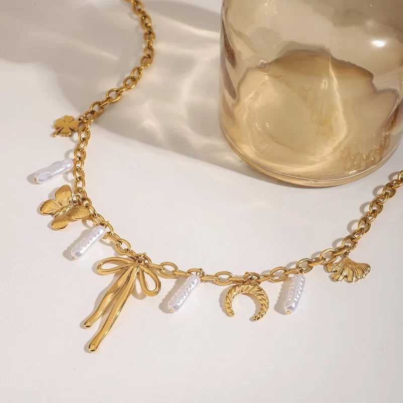 J&D Stainless Steel 18K PVD Gold Plating Ocean Beach Horse Hoof Butterfly Knot Four Leaf Clover Necklace - Image 4
